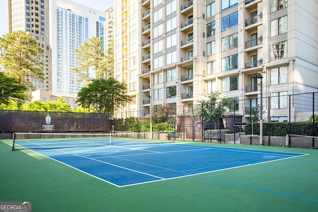 3445 Stratford Rd NE Unit 1605, Atlanta, GA 30326 - view of tennis court with community basketball court and fence