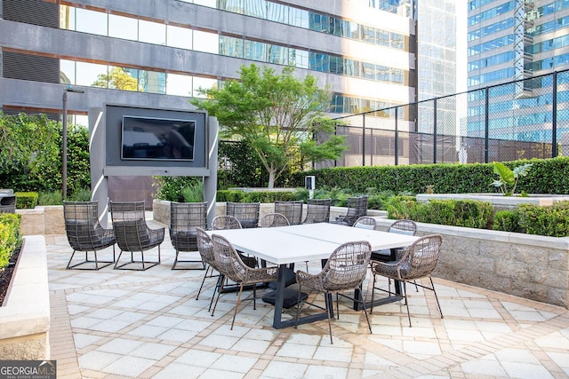 3445 Stratford Rd NE Unit 1605, Atlanta, GA 30326 - view of patio featuring outdoor dining space