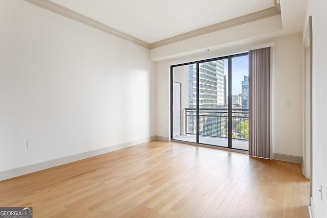 3445 Stratford Rd NE Unit 1605, Atlanta, GA 30326 - unfurnished room with light wood-style floors, baseboards, crown molding, and a view of city