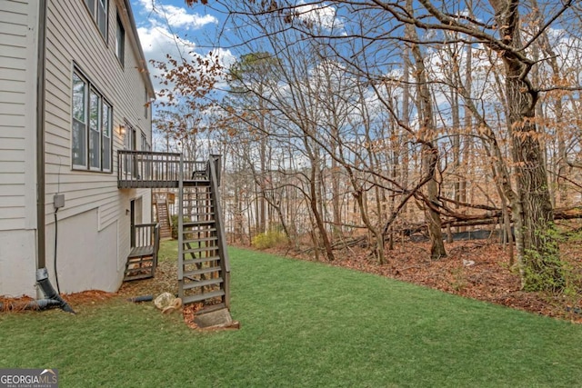 view of yard featuring stairway and a wooden deck