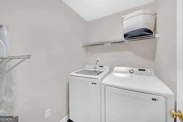 laundry room featuring laundry area and washer and clothes dryer