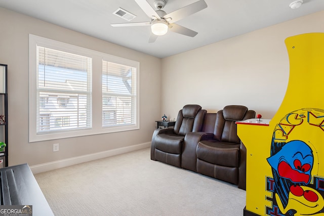 interior space featuring a ceiling fan, carpet, visible vents, and baseboards