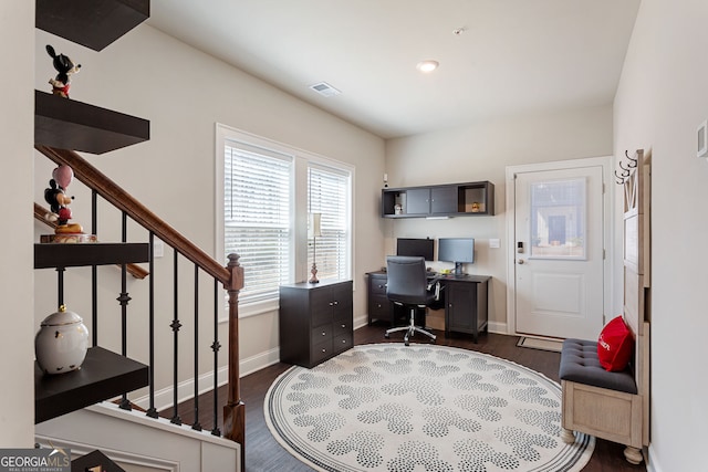 office area with dark wood-type flooring, recessed lighting, visible vents, and baseboards