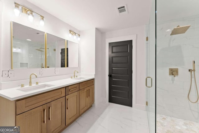 full bath with marble finish floor, a marble finish shower, a sink, and visible vents