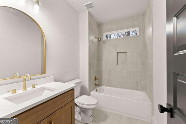 bathroom featuring toilet, shower / tub combination, vanity, and visible vents