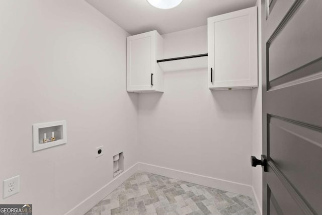 laundry area with washer hookup, cabinet space, electric dryer hookup, and baseboards