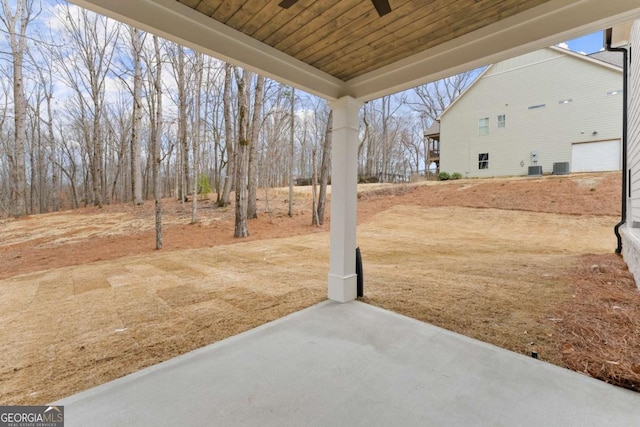 view of yard with a patio and central AC unit