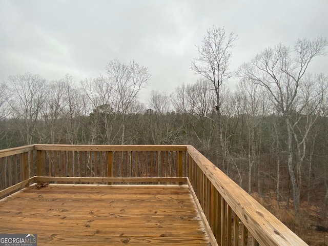 deck featuring a view of trees