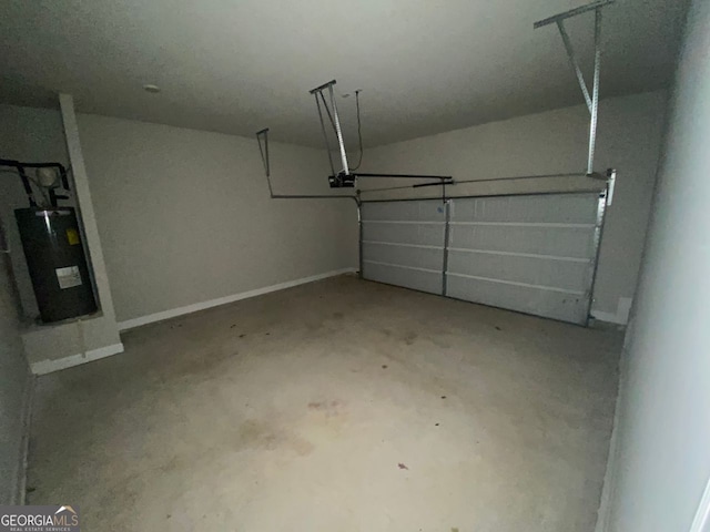 garage with a garage door opener, water heater, and baseboards