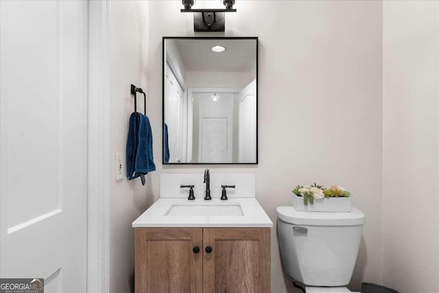 half bath with toilet and vanity