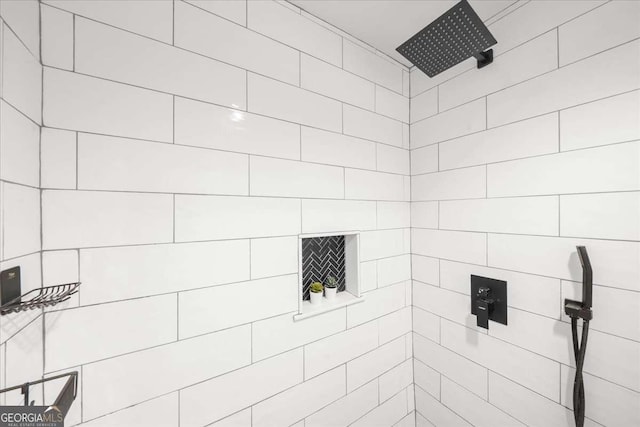 full bathroom with tiled shower