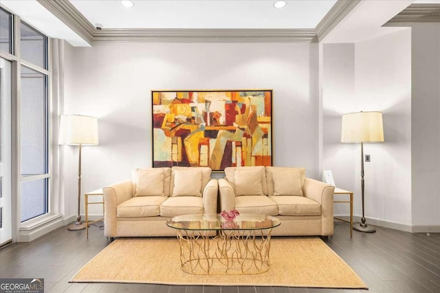 living area featuring baseboards, recessed lighting, wood finished floors, and crown molding