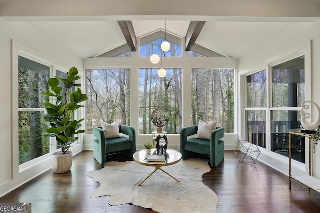 sunroom featuring vaulted ceiling with beams