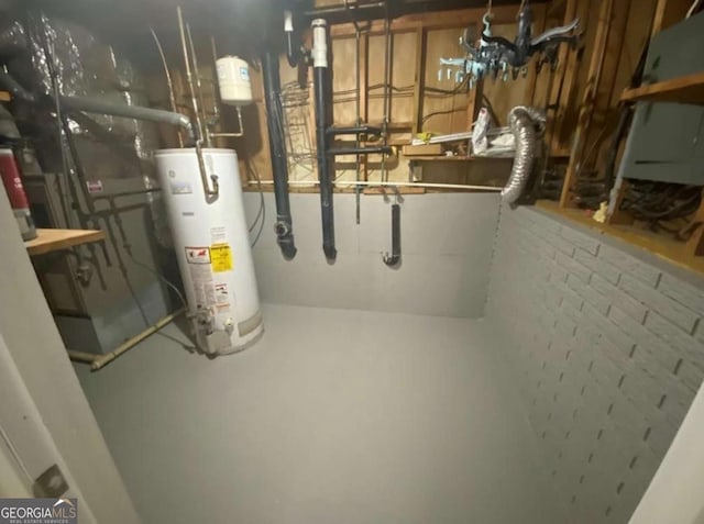 utility room featuring water heater