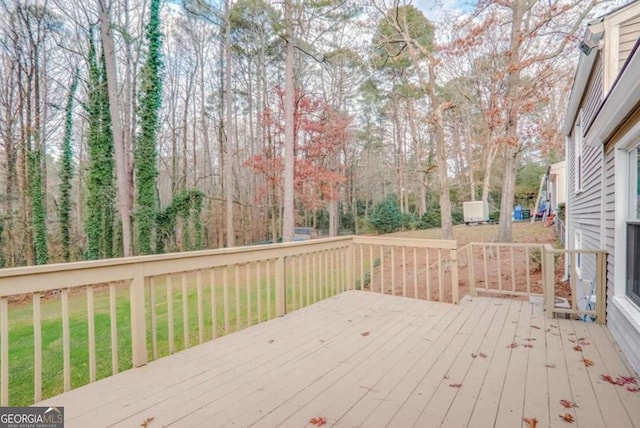 wooden deck with a yard