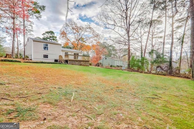 view of yard featuring a deck