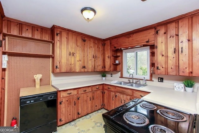 kitchen with light countertops, a sink, black appliances, and open shelves