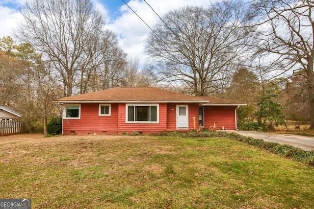 ranch-style house featuring a front yard, crawl space, and fence