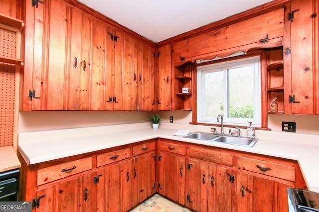 kitchen featuring open shelves, a sink, light countertops, and brown cabinets