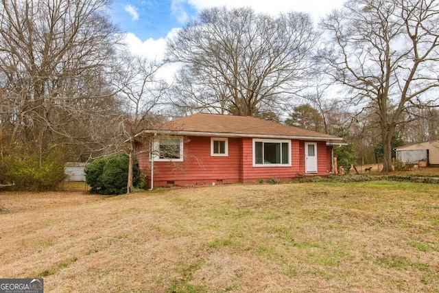 exterior space featuring crawl space and a lawn