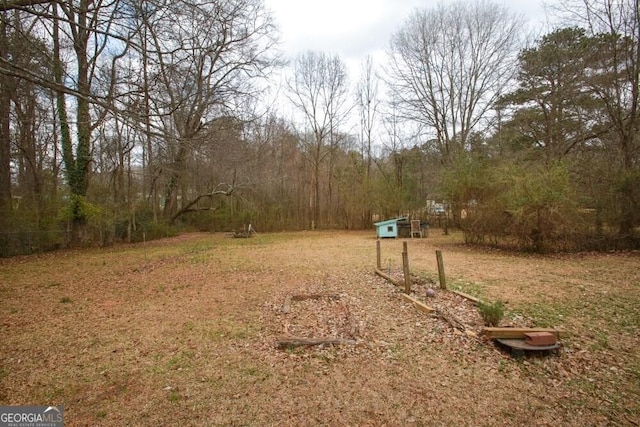 view of yard with a wooded view