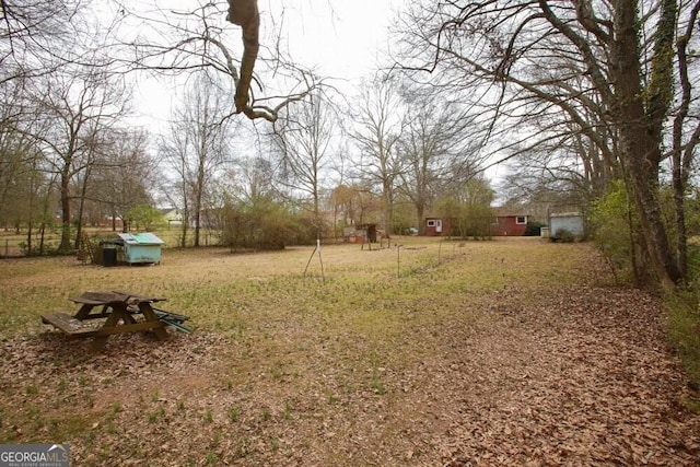 view of yard with a storage unit and an outdoor structure