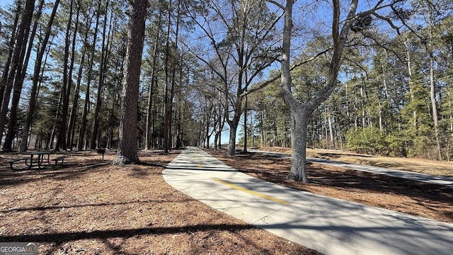 view of street featuring a wooded view