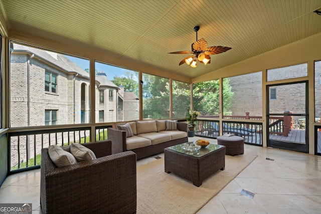 sunroom / solarium featuring lofted ceiling, wood ceiling, and ceiling fan