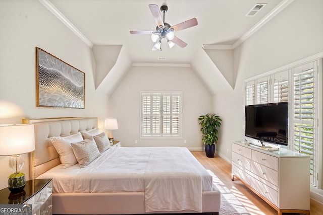 bedroom with ceiling fan, visible vents, baseboards, light wood finished floors, and crown molding