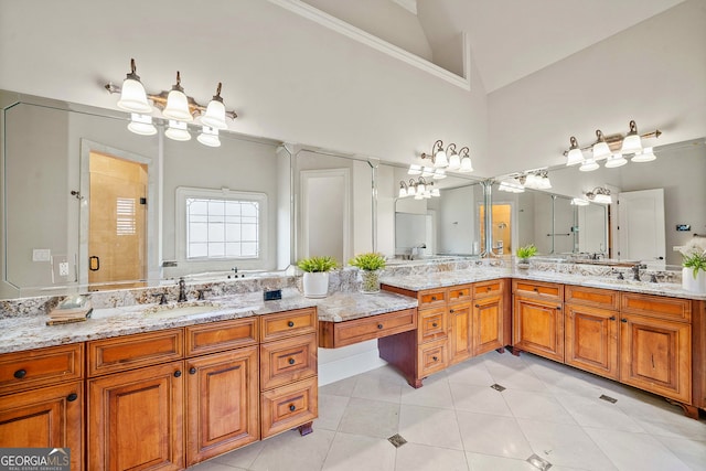 full bathroom featuring high vaulted ceiling, a shower stall, vanity, and tile patterned floors