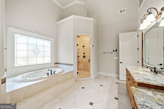 full bathroom featuring visible vents, a towering ceiling, vanity, a shower stall, and a bath