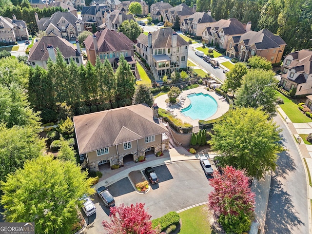 birds eye view of property with a residential view