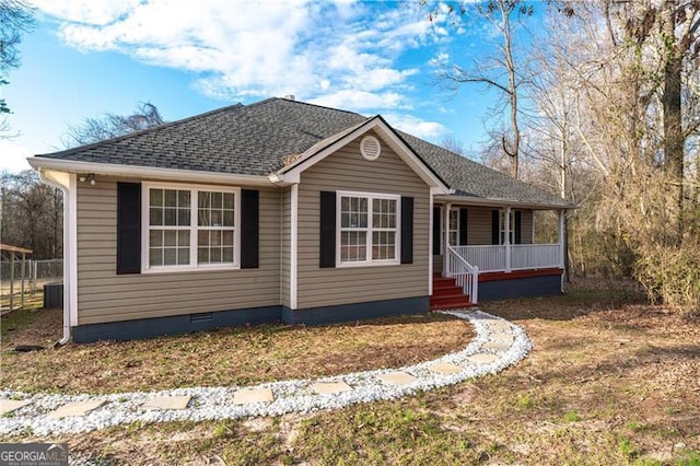 view of front of house featuring crawl space, covered porch, and roof with shingles