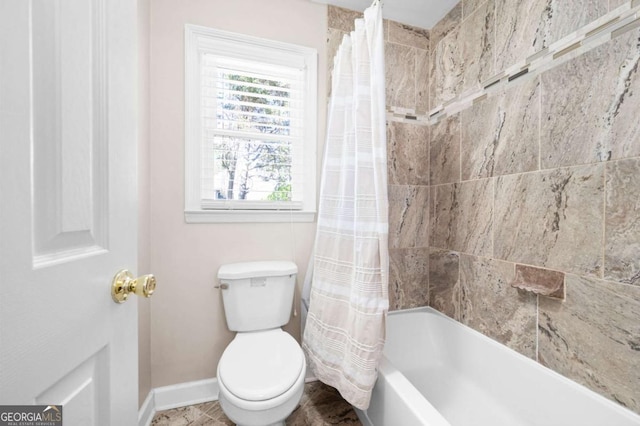 full bath featuring baseboards, toilet, and shower / bath combination with curtain