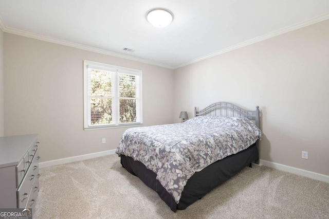 bedroom with light carpet, visible vents, baseboards, and ornamental molding