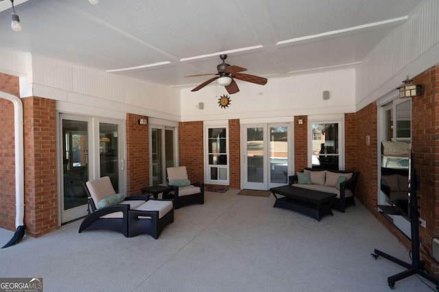 view of patio with an outdoor living space and a ceiling fan