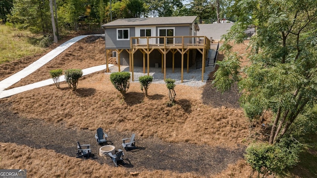 6564 Bermuda Ln, Flowery Branch, GA 30542 - rear view of property featuring a deck, stairway, and a patio area