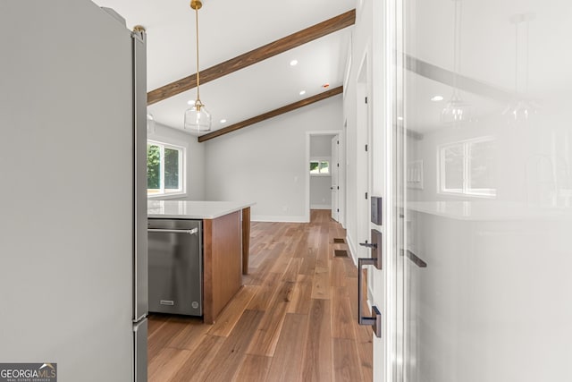 6564 Bermuda Ln, Flowery Branch, GA 30542 - kitchen featuring appliances with stainless steel finishes, light wood-style flooring, light countertops, pendant lighting, and baseboards