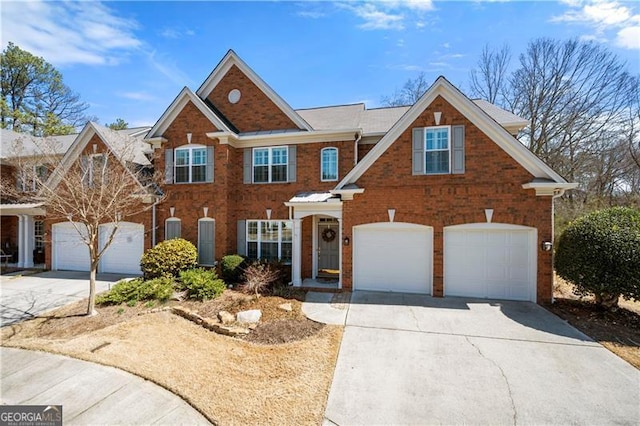 view of front of house with brick siding, driveway, and an attached garage