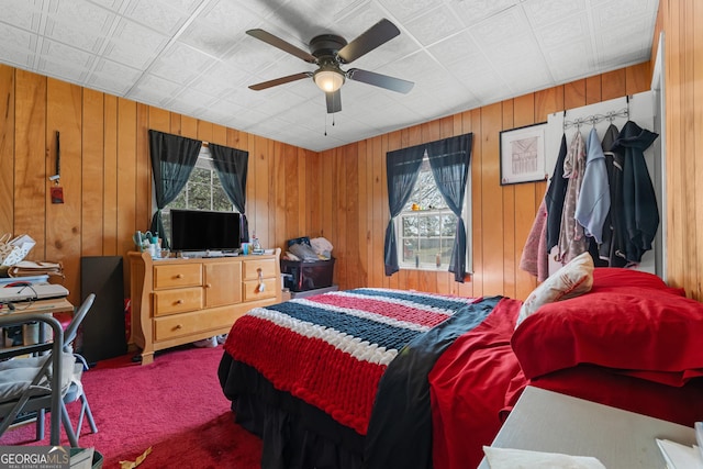 bedroom featuring multiple windows and ceiling fan