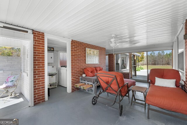 sunroom featuring a ceiling fan