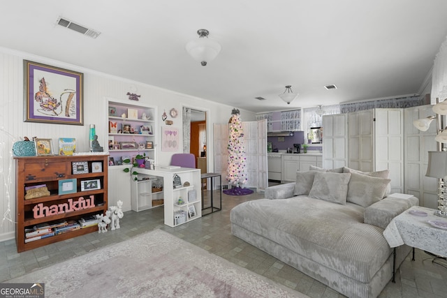 bedroom with visible vents and crown molding