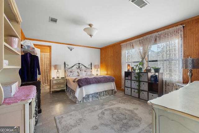 bedroom with visible vents and ornamental molding