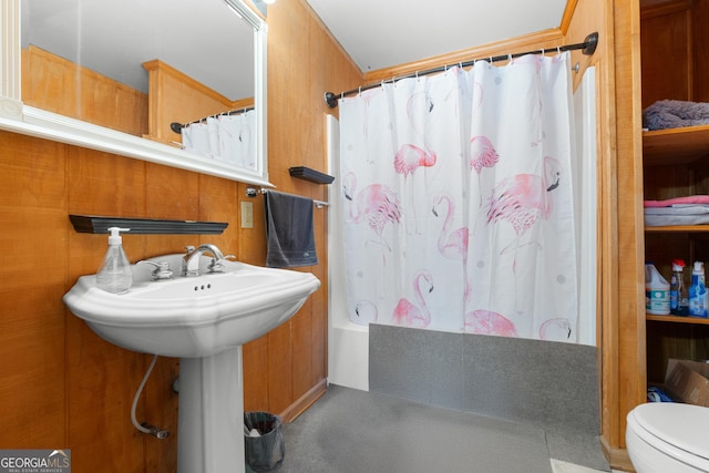 bathroom with toilet and shower / bath combo