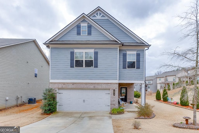 view of front of home featuring a garage, central air condition unit, concrete driveway, and brick siding