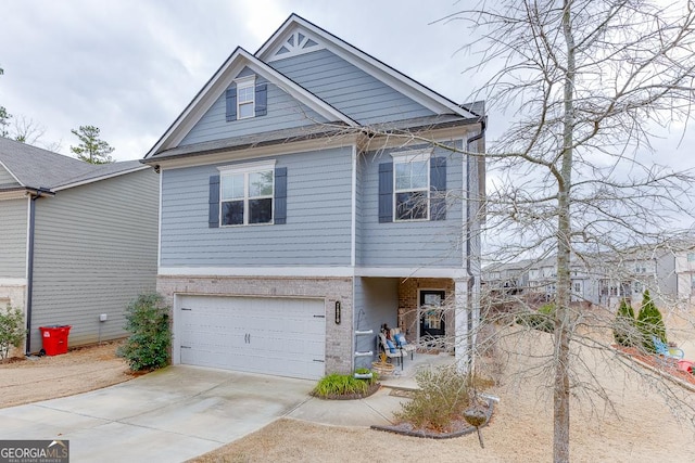 view of front of house with a garage, concrete driveway, and brick siding