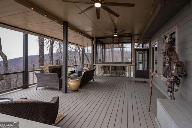 132 Sanderlin Mountain Dr S, Big Canoe, GA 30143 - sunroom featuring a ceiling fan, a mountain view, and healthy amount of natural light