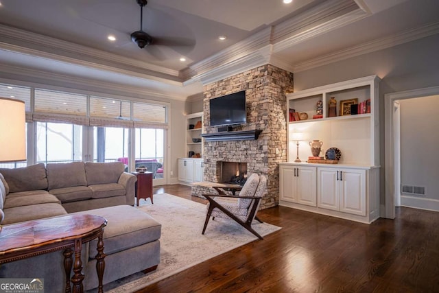 132 Sanderlin Mountain Dr S, Big Canoe, GA 30143 - living room featuring a raised ceiling, crown molding, a ceiling fan, a fireplace, and dark wood-type flooring