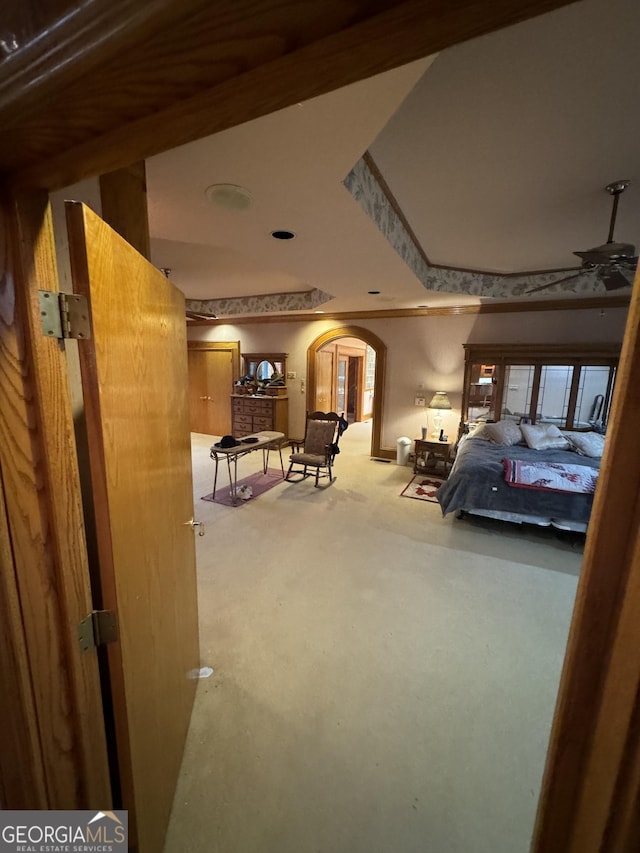 interior space featuring arched walkways and ornamental molding