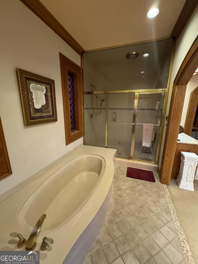 bathroom featuring a garden tub, ornamental molding, a shower stall, and recessed lighting